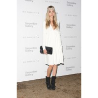 Boho babe: Cara channels her inner earth angel in a cream mid-length dress. Biker-style accessories and boots offer edgy appeal. http://www.sheknows.com/beauty-and-style/what-s-your-style-gallery/celebs-wearing-the-bohemian-trend